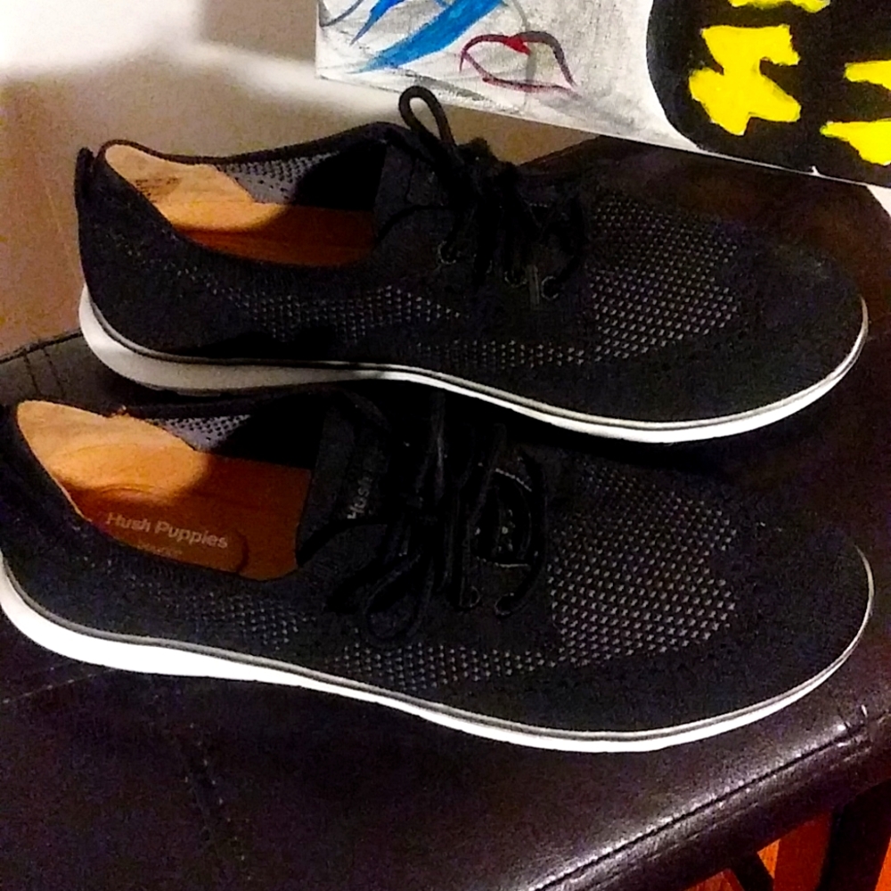 HUSH PUPPIES -Black with sliver stripe around the white bottom .